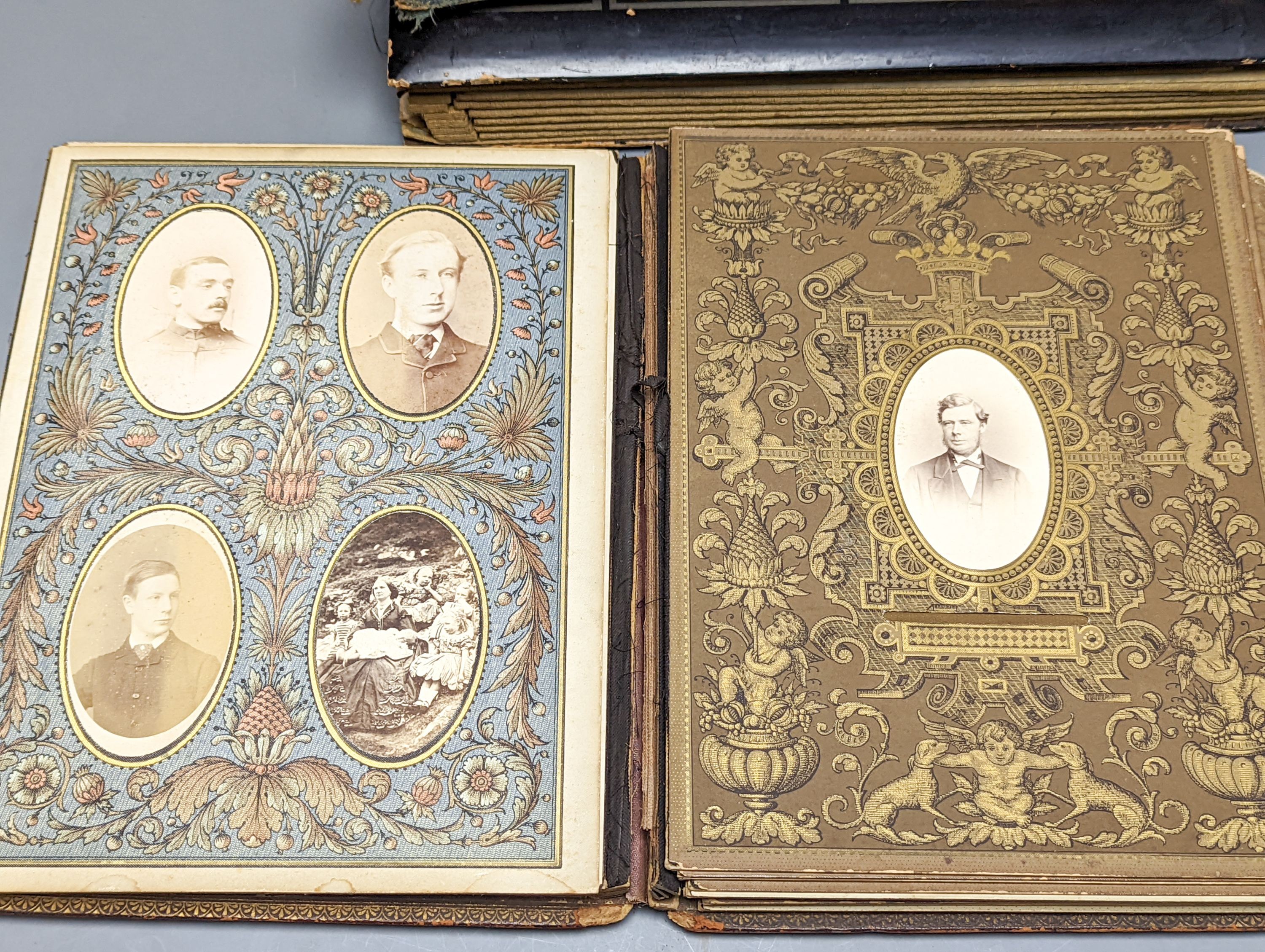 Two early 20th century postcard albums, a photo album and a collection of loose postcards